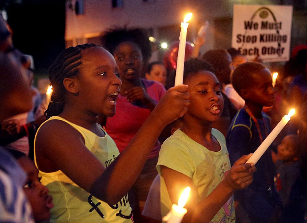 Best friends and neighbors Destiny Sonnier, 9, and Akeelah Kelly, 8, shout, “Justice for Jamyla!” during a community march against violence in August. Both girls live on Ellison Drive in Ferguson and endured months of protests after the death of Michael Brown. Then, their classmate Jamyla Bolden was killed.