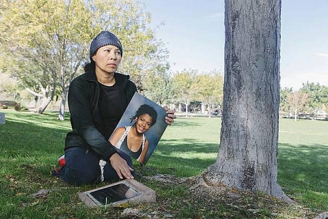 Helen Melendez visits a plaque memorializing her daughter on Monday, Nov. 16, 2015, at Discovery Park. Her daughter, Claudia, killed herself five years ago and, since then, Melendez has pushed for more mental health awareness in the community, especially at schools.