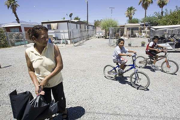 Ana Sanchez, a resident at St. Anthony's Mobilehome Park near Mecca, doesn't have a car to make the 20 minute drive to Coachella