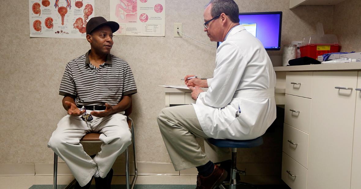 ETHAN HYMAN / ETHAN.HYMAN@NEWSOBSERVER.COM Dr. Greg Murphy talks with Jasper Barrett at Eastern Urological Associates in Greenville on Thursday, April 30, 2015. Barrett had prostate cancer.