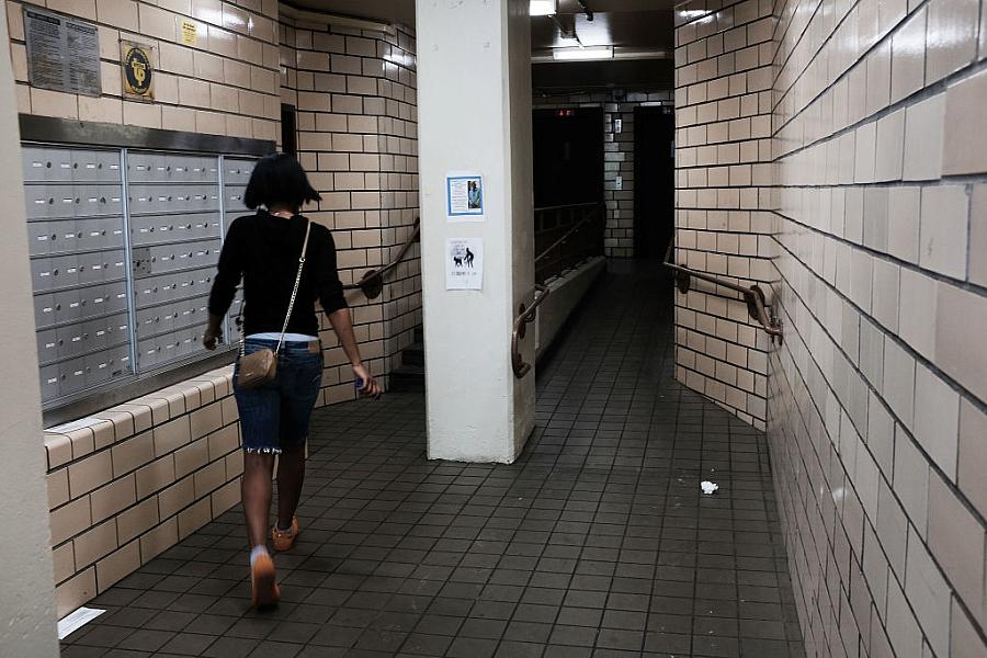 Image of a person walking in corridor