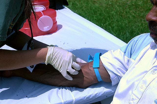 A man is tested for HIV on a community outreach day.