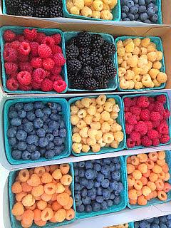 Berry display at a farmer's market.
