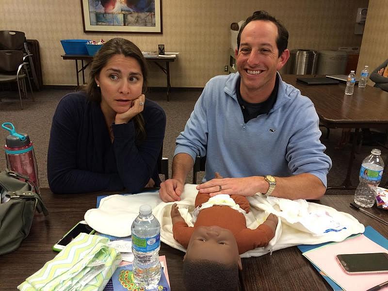 First-time expectant parents Melissa and Michael Funaro find the lessons of parenthood somewhat daunting at an infant care class at Shawnee Mission Medical Center in Merriam, Kansas. CREDIT ALEX SMITH / HEARTLAND HEALTH MONITOR