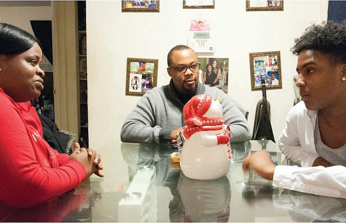 Family therapist Ayize Ma’at, center, meets with the Brighthaupts during their weekly in-home counseling session. Below, Jamari with his father Steve Victor, who says he’s trying to get himself together so that he can spend more time with his son.