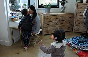 Comedian, actress and postpartum depression survivor Jiaoying Summers with her 4-year-old son and 2-year-old daughter in their home 