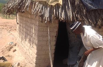 traditional birth attendant entering a shelter to check on a pregnant woman