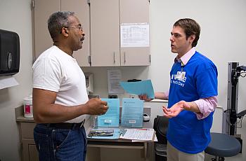 SHAWN ROCCO / DUKE MEDICINE PHOTOGRAPHY William Thorpe, 64, left, speaks with Dr. Michael Lipkin, a urology specialist from Duke, after a prostate examination during the Mens' Health Day at Lincoln Community Health Center in Durham in September 2014.