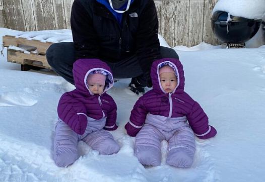 Twins Anna and Mila with their father, John Melovidov, in St. Paul. 