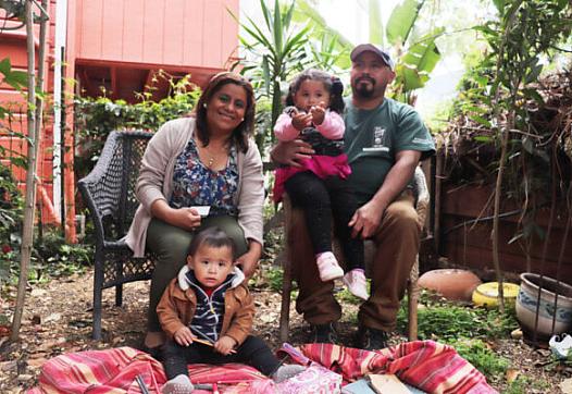 Marta Salinas Cruz, her husband Melvin Zuniga and their two children, Joshua Emanuel and Deborah Arleth, pose for a portrait. 