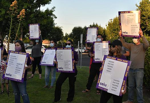 Westgate Gardens Care Center staff held a vigil at the nursing home, calling for boosted pay and better treatment.