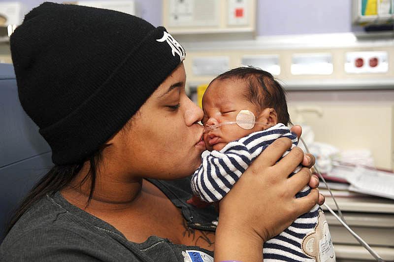 Alaina Gonville kisses her 3-month-old Brandon at the Neonatal Intensive Care Unit at Hutzel Women's Hospital in Detroit. Brandon was born premature through an emergency C-section. (Max Ortiz / The Detroit News) Alaina Gonville kisses her 3-month-old Brandon at the Neonatal Intensive Care Unit at Hutzel Women's Hospital in Detroit. Brandon was born premature through an emergency C-section. (Max Ortiz / The Detroit News)