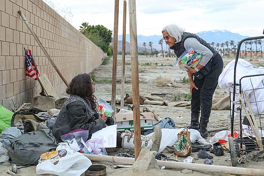 Terry Ramon, right, talks with a young homeless woman in Indio. Terry Ramon, right, talks with a young homeless woman in Indio.