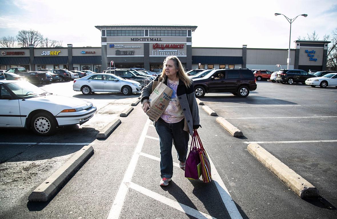 Michele Dutcher takes a bus to and from the Valumarket at the Mid City Mall on Bardstown Road a few times a week for groceries. She can't carry a lot so frequent trips are necessary from her Old Louisville apartment. Michele Dutcher takes a bus to and from the Valumarket at the Mid City Mall on Bardstown Road a few times a week for groceries.