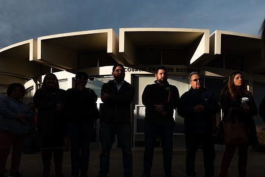 Housing advocate Matt Huerta (fourth from the left), stands outside Salinas City Hall during a December 2019 rally.