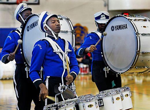 Maleak Taylor (left), a freshman at North Divison High School, plays quints for the drumline during the MPS Hosts City Drumlime 