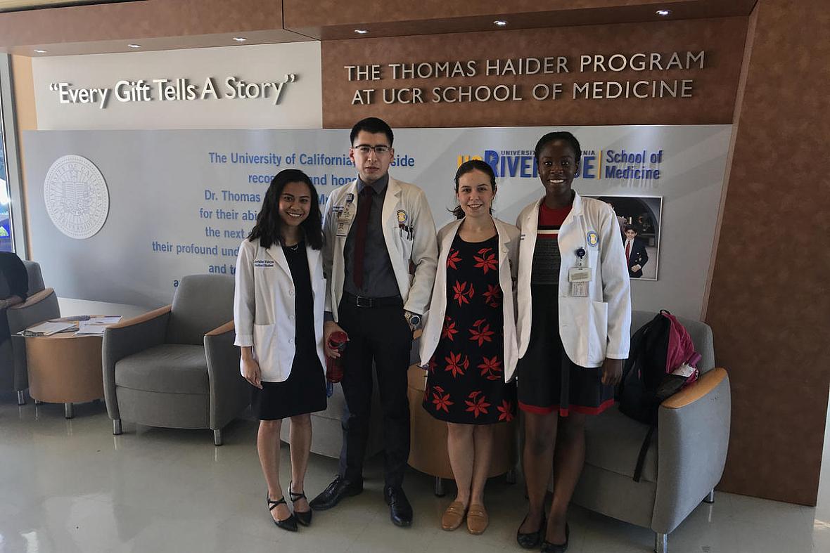 UCR medical students Jericha Viduya, Antonio Garcia, Monica Gutierrez, and Kleshie Baisie pose for a picture in their white coats. Credit Benjamin Purper / KVCR UCR medical students Jericha Viduya, Antonio Garcia, Monica Gutierrez, and Kleshie Baisie pose for a picture in their white coat