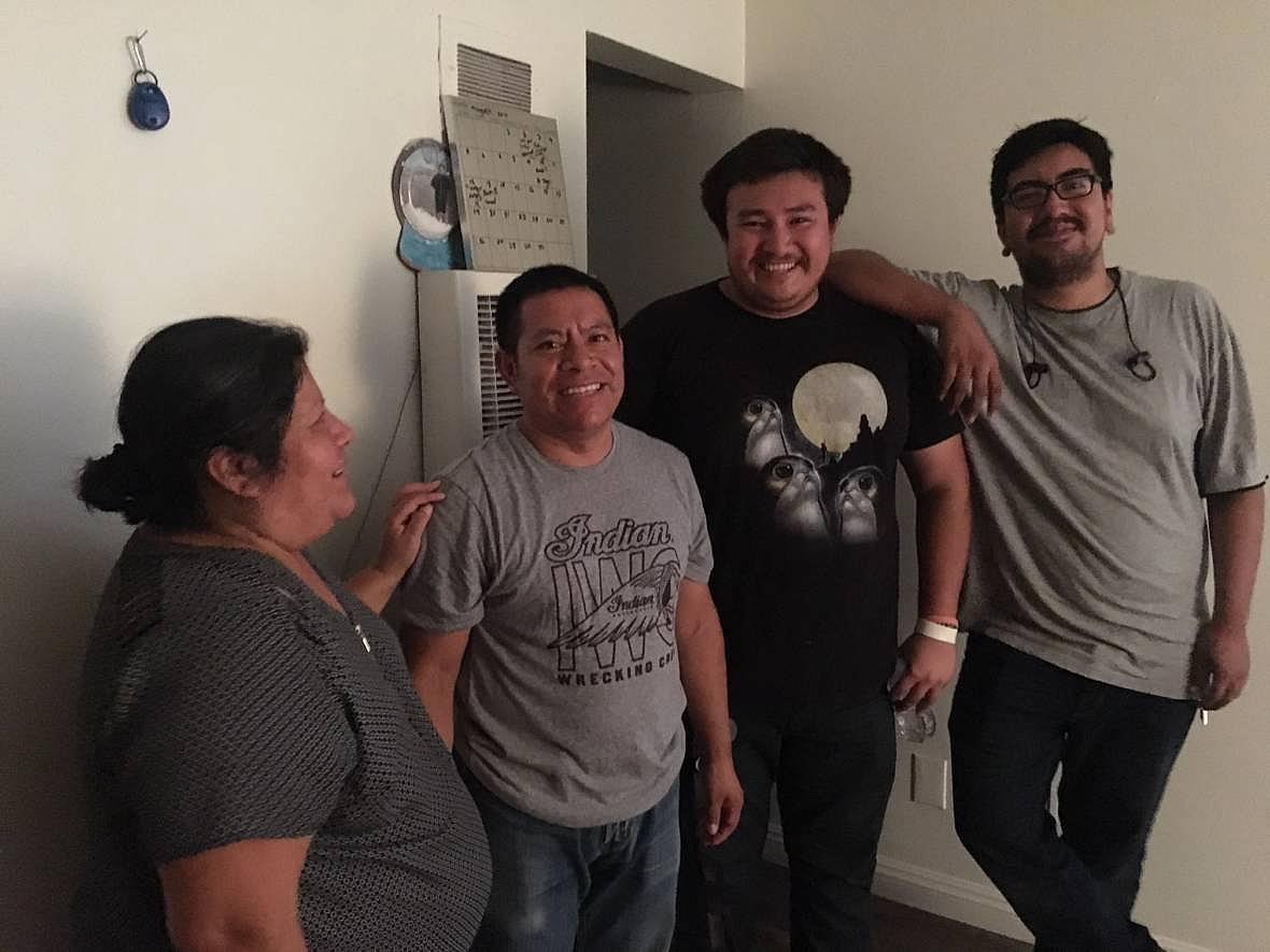 We placed a sensor inside the home of Cristina Sanchez (L) and her husband Felino Chanax (next to L), in Maywood, in southeast Los Angeles. The hottest their home got was 97 degrees. Also pictured are producers Miguel Vargas (next to Chanax) and Osvaldo Pedroza. (Photo: Molly Peterson/KQED) We placed a sensor inside the home of Cristina Sanchez (L) and her husband Felino Chanax (next to L), in Maywood, in southeast L