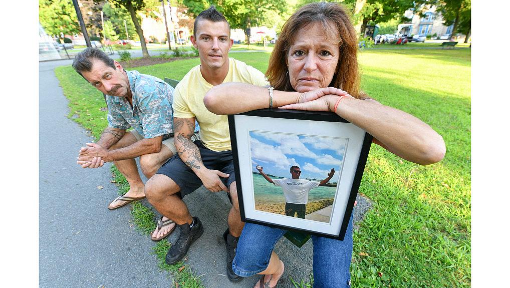Lynne Russell, of Hawley Pa., holds a photo of her late son, Patrick, on July 25, 2019, as she sits with her husband Patrick. Lynne Russell, of Hawley Pa., holds a photo of her late son, Patrick, on July 25, 2019, as she sits with her husband Patrick.