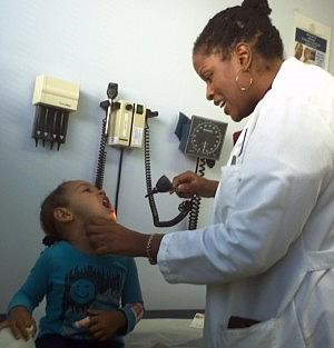 Pediatrician Porshia Mack examines 3-year-old Sania Bettancourt at Richmond LifeLong community health clinic.