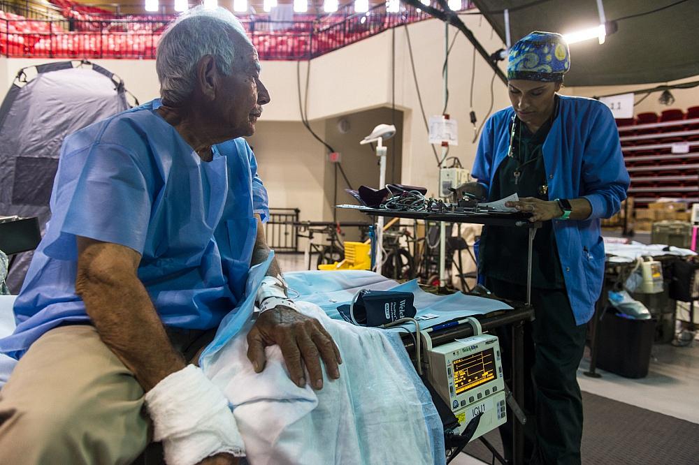 A local resident from Humacao, Puerto Rico, is prepared for hand surgery.