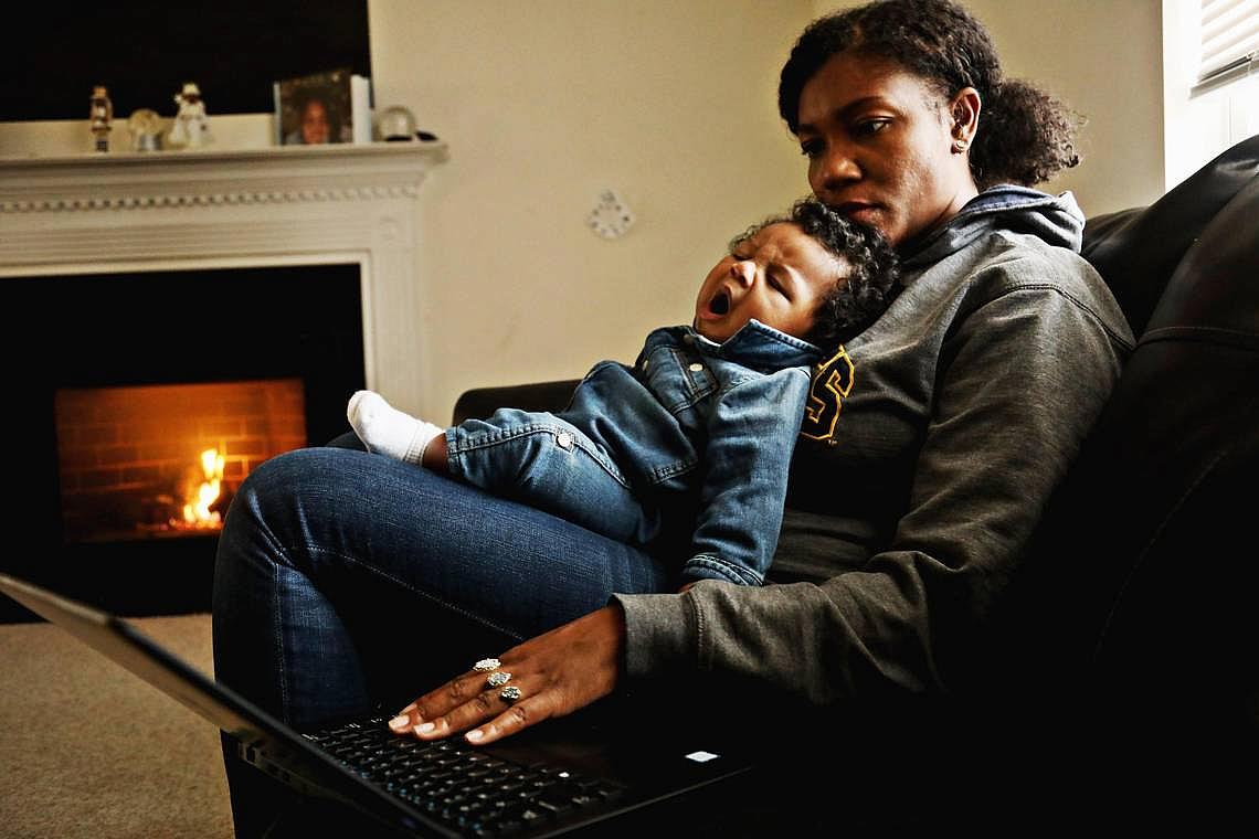 Richard yawns in mom Jessica Murrell Berryman’s lap as she works remotely from the family’s Durham home Dec. 6, 2019.