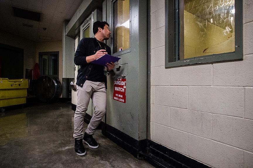 Clinician Marvin Rodriguez checks on an inmate in a suicide-watch cell at West Valley Detention Center in Rancho Cucamonga on Friday, June 21, 2019. Clinician Marvin Rodriguez checks on an inmate in a suicide-watch cell at West Valley Detention Center in Rancho Cucamonga on Fr