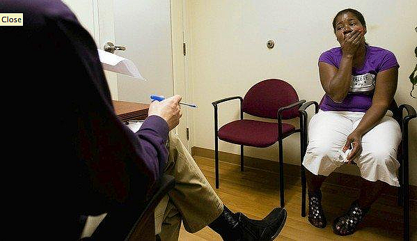 A patient talks about her depression to therapist Neil Martin at T.H.E. Clinic in South Los Angeles. “It’s so linked, physical and mental health,” Martin said. (Gina Ferazzi, Los Angeles Times)