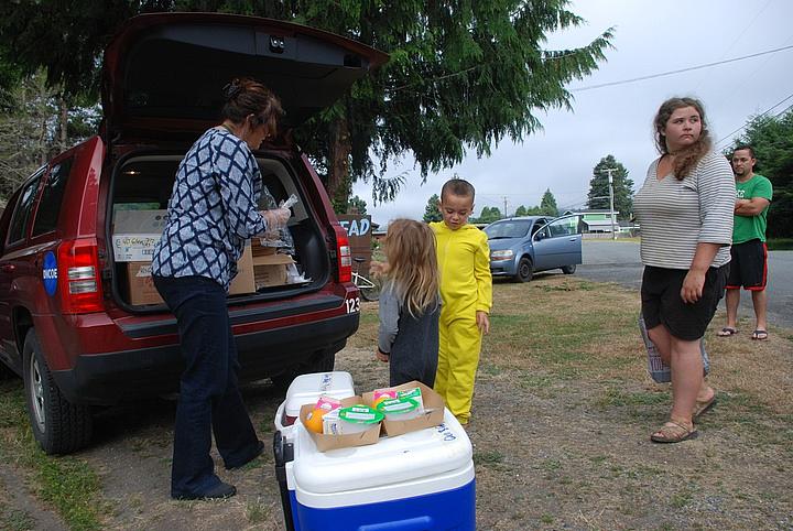 Deborah Kravitz gives breakfast to 6-year-old Mateo Rodriguez and his 4-year-old sister AnnaLee in Klamath Glen.