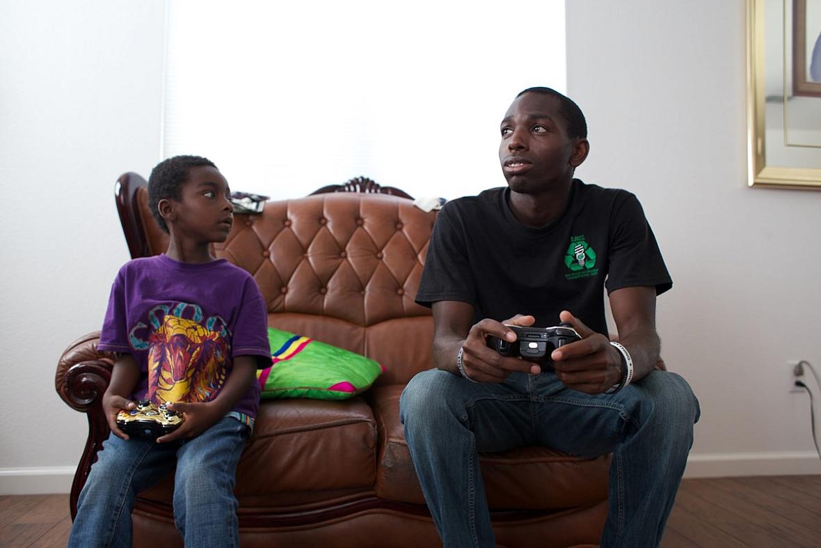 Roosevelt Webb (right) plays video games with his nephew. 