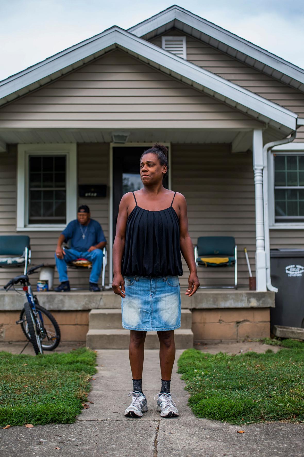 Ashley's biological mother Kim Guiden stands in front of her home in Anderson, Indiana, in 2017.