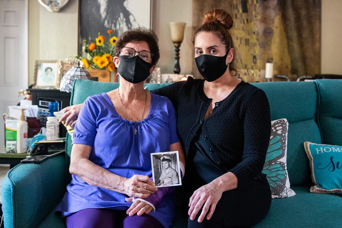 Elvia Sandoval and her daughter, Marcella Reed, pose with a photo of Reed’s grandfather, Walter Anderson, who contracted COVID-19 while living at Elmcroft of La Mesa. Elvia Sandoval and her daughter, Marcella Reed, pose with a photo of Reed’s grandfather, Walter Anderson, who contracted COVID-1