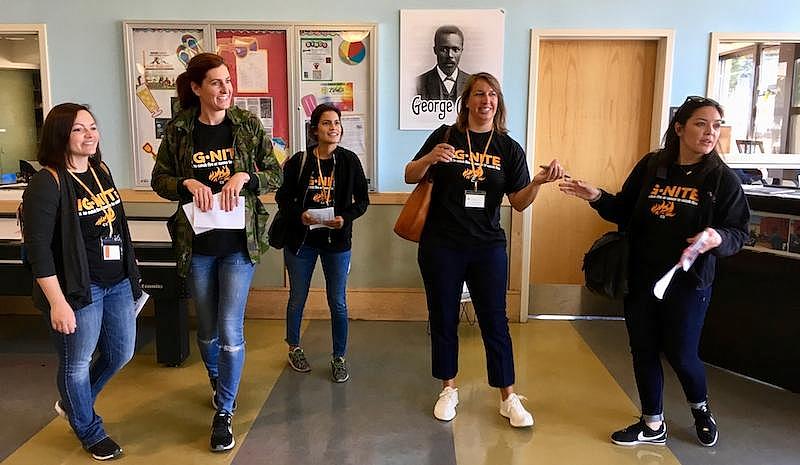 Karina Garcia, center, a new kindergarten teacher at Dr. George Washington Carver Elementary School, checks out the Joseph Lee R