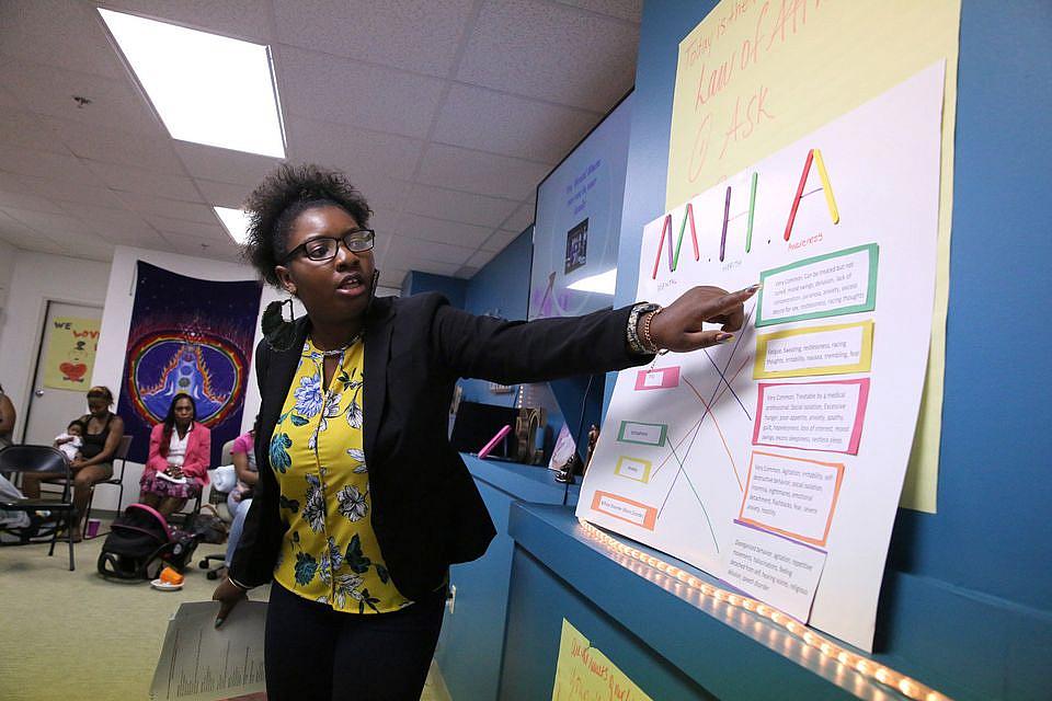 Program assistant and a doula herself, Rod'Neyka Jones discusses mental health issues at a Birthing Beautiful Communities teaching session of expectant and new mothers taught by program assistant and doula Rod'Neyka Jones on Thursday, June 29, 2017. (Thomas Ondrey/The Plain Dealer) Program assistant and a doula herself, Rod'Neyka Jones discusses mental health issues at a Birthing Beautiful Communities.