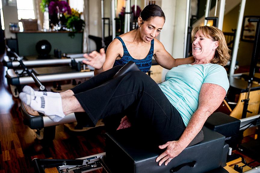Julie Swann-Paez, a survivor of the Dec. 2 San Bernardino shooting, works with Pilates instructor Valerie Chargois to strengthen muscles during her recovery at Pilates 909 in Rancho Cucamonga on Saturday, July 15, 2017. Swann-Paez was shot twice in the pelvis during the terror attack. (Photo by Watchara Phomicinda, The Press-Enterprise/SCNG) Photo by Watchara Phomicinda, The Press-Enterprise/SCNG