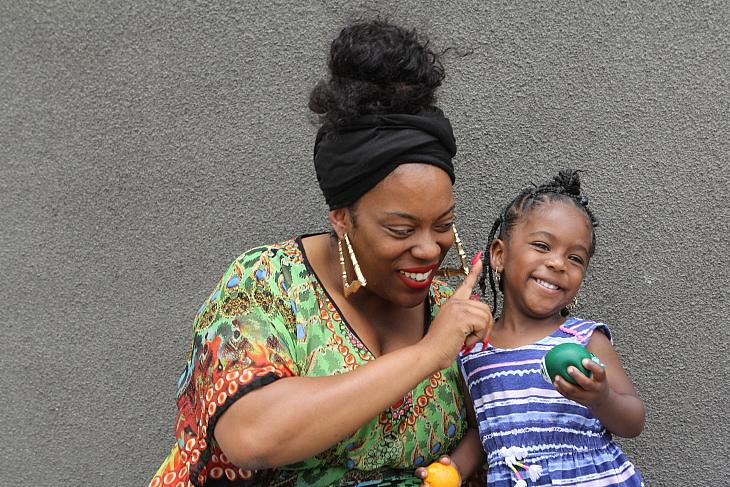 Raena Granberry and her 2-year-old daughter Justice. Granberry lost a child who was born premature. She now works to educate black women of the risks. (Priska Neely/KPCC) Priska Neely/KPCC