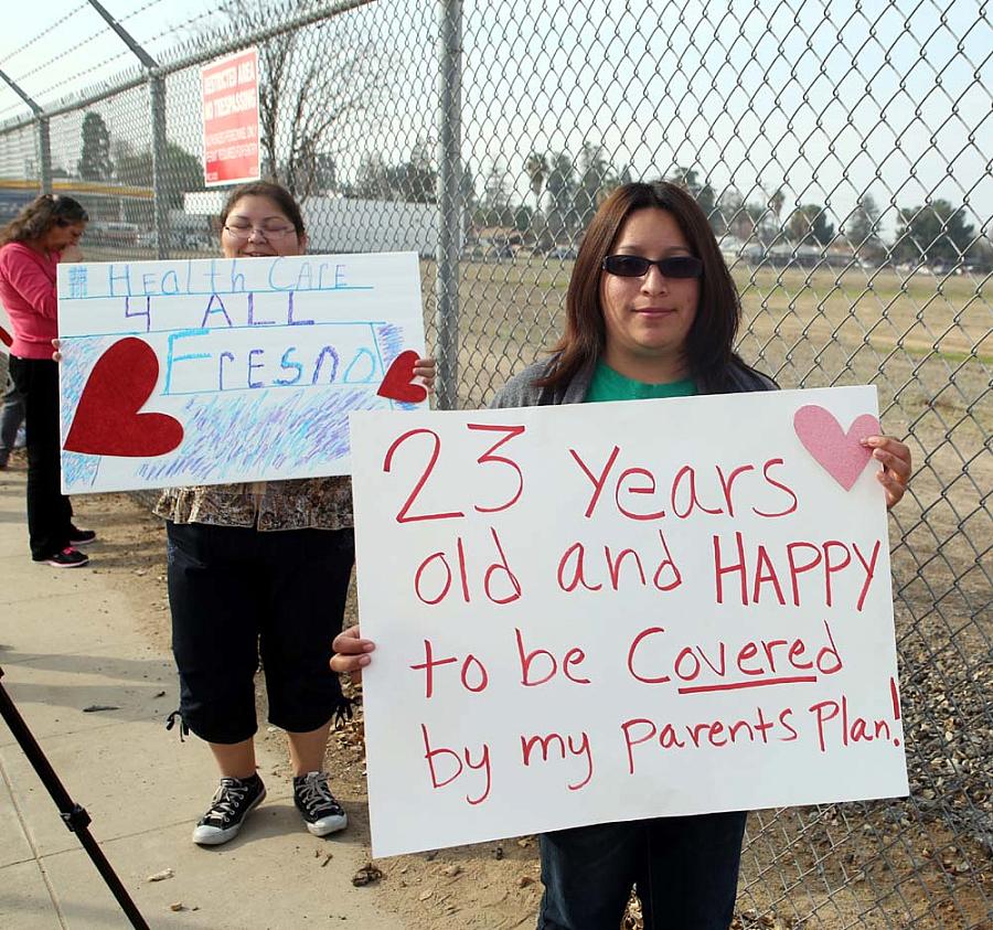 Fresno residents Blanca Gomez, in front, and Sonia Gutierrez had a message for President Obama during his visit to the Central Valley on Feb. 14.