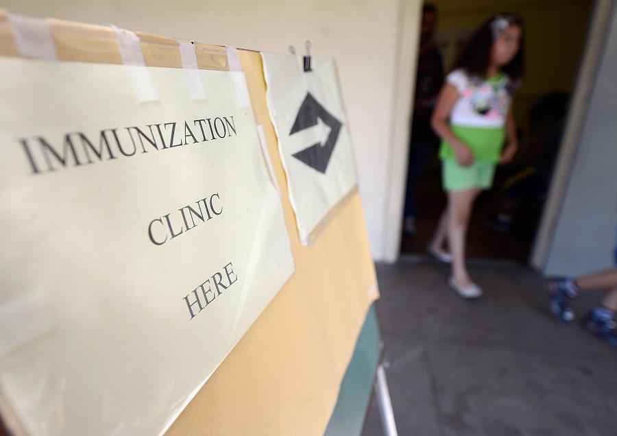 Students leave the school nurse office after receiving a vaccine against whooping cough at Mark Twain Middle School in Los Angeles. (Photo by Kevork Djansezian/Getty Images)