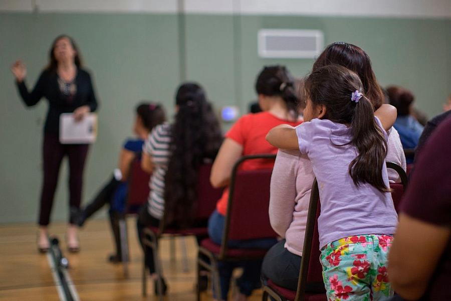 A girl watches during a workshop that teaches immigrants how to make a preparedness plan. (Photo: David McNew/AFP/Getty Images) A girl watches during a workshop that teaches immigrants how to make a preparedness plan. (Photo: David McNew/AFP/Getty Images)