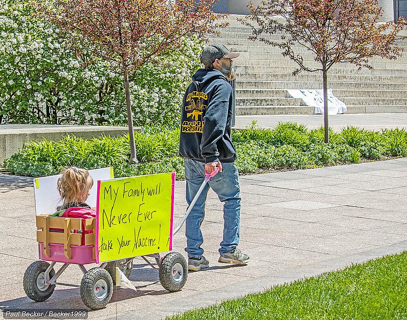 A man pulls a wagon at an “Open Ohio” protest rally in front of the statehouse this spring. A man pulls a wagon at an “Open Ohio” protest rally in front of the statehouse this spring.