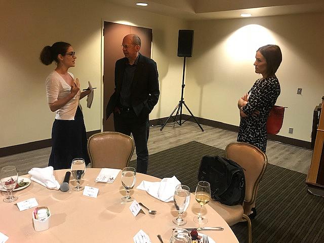 Alex Kotlowitz, center, speaks with reporters at the 2019 National Fellowship this week.