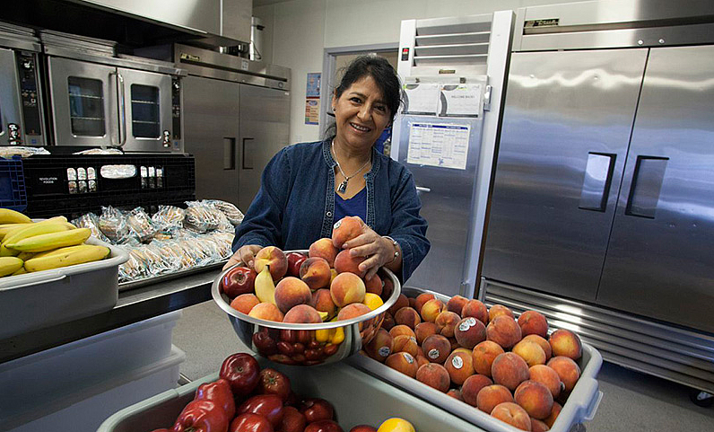 Reporter Leilani Clark's story featured Hortencia Garcia, food service manager at Roseland Elementary, who prepares fresh produce for students. (Photo by Michael Amsler/North Bay Bohemian)
