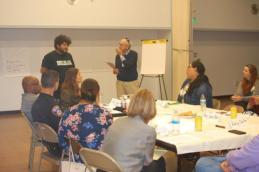 Edgar Avila and Steve Mencher speak with community members in Roseland, California. Photo via Olivia Henry