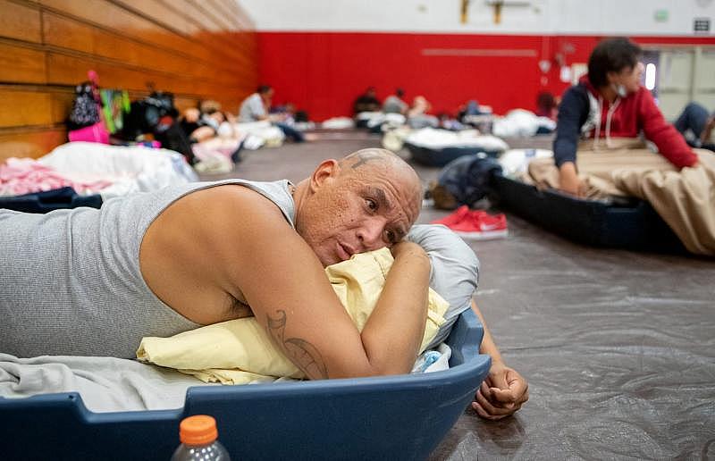 Johnny Alvarez, 47, rests inside the emergency overnight shelter run by the Coachella Valley Rescue Mission inside a portion of the Palm Springs High School Gymnasium on Saturday , June 27, 2020. Taya Gray, Taya Gray Johnny Alvarez, 47, rests inside the emergency overnight shelter run by the Coachella Valley Rescue Mission inside a portion of the Palm Springs High School Gymnasium on Saturday , June 27, 2020. Taya Gray, Taya Gray