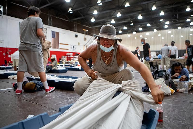 Johnny Alvarez, 47, secures a sheet to his mattress inside the emergency overnight shelter run by the Coachella Valley Rescue Mission inside a portion of the Palm Springs High School Gymnasium on Saturday , June 27, 2020. Taya Gray, Taya Gray Johnny Alvarez, 47, secures a sheet to his mattress inside the emergency overnight shelter run by the Coachella Valley Rescue Mission inside a portion of the Palm Springs High School Gymnasium on Saturday , June 27, 2020. Taya Gray, Taya Gray