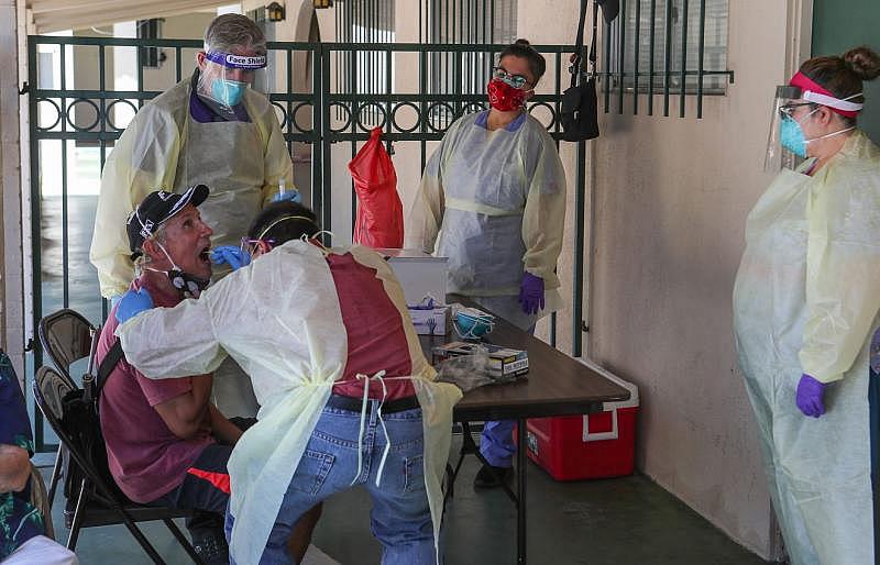 Dr. Richard Loftus administers a coronavirus test to Ronald Rogers at Our Lady of Guadalupe Church in Palm Springs, May 15, 2020. Rogers was one of several homeless people being tested for coronavirus. The Coachella Valley Volunteers in Medicine tested homeless individuals. Jay Calderon/ The Desert Sun Dr. Richard Loftus administers a coronavirus test to Ronald Rogers at Our Lady of Guadalupe Church in Palm Springs, May 15, 2020. Rogers was one of several homeless people being tested for coronavirus. The Coachella Valley Volunteers in Medicine tested homeless individuals. Jay Calderon/ The Desert Sun