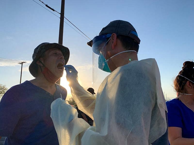 Rep. Raul Ruiz, D-Palm Desert, performs a COVID-19 test on an individual experiencing homelessness in the eastern Coachella Valley. Ruiz, a physician, worked with the Coachella Valley Volunteers in Medicine to bring testing to the streets. Hernan Quintas Rep. Raul Ruiz, D-Palm Desert, performs a COVID-19 test on an individual experiencing homelessness in the eastern Coachella Valley. Ruiz, a physician, worked with the Coachella Valley Volunteers in Medicine to bring testing to the streets. Hernan Quintas