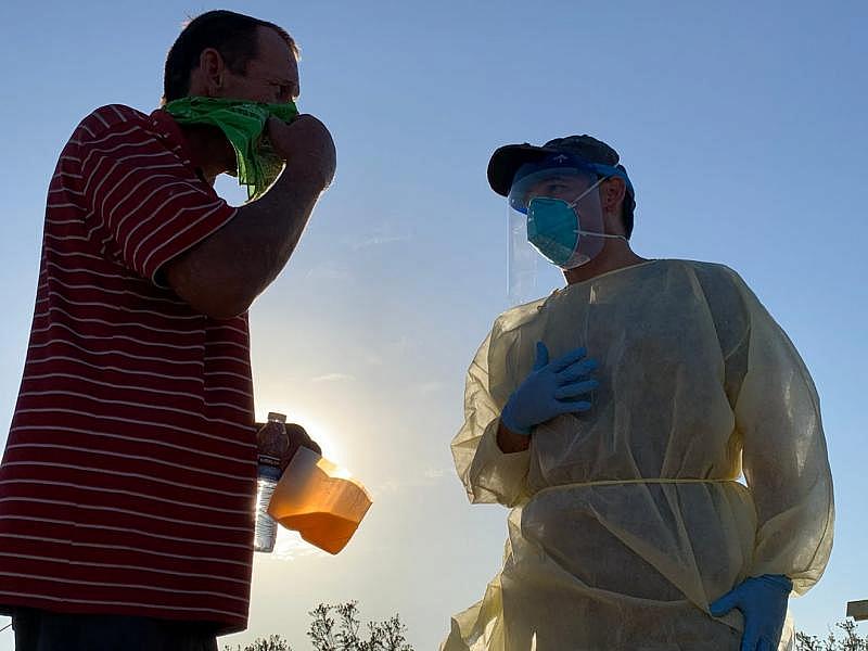 Congressman Paul Ruiz talks with an individual experiencing homelessness in the eastern Coachella Valley before testing him for COVID-19. Ruiz worked with the Coachella Valley Volunteers in Medicine to bring testing to the streets. Hernan Quintas Congressman Paul Ruiz talks with an individual experiencing homelessness in the eastern Coachella Valley before testing him for COVID-19. Ruiz worked with the Coachella Valley Volunteers in Medicine to bring testing to the streets. Hernan Quintas