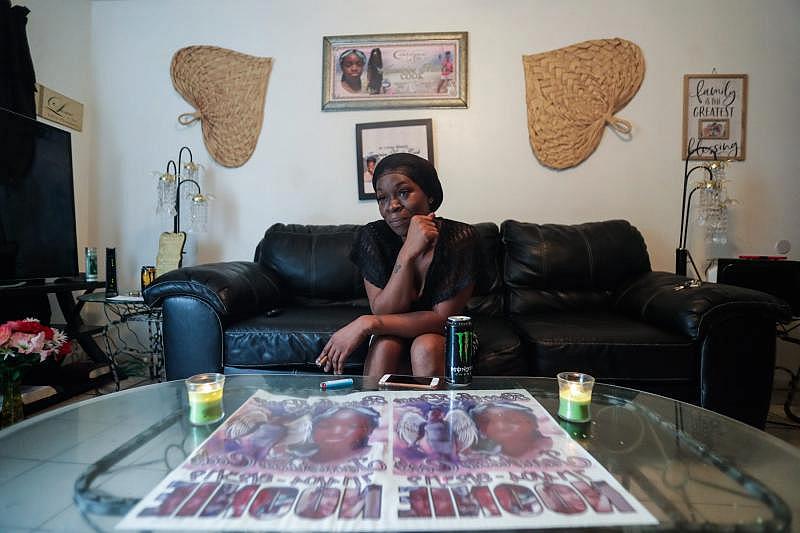 Koquisha Cook, 36, sits in her living room as she shares fond memories of her daughter Jamirica "Noonie" Cook, 15, who was shot and killed last year in her home in the Springfield Apartment complex. Photographs and tributes to Noonie decorate Cook's home. ALICIA DEVINE/TALLAHASSEE DEMOCRAT