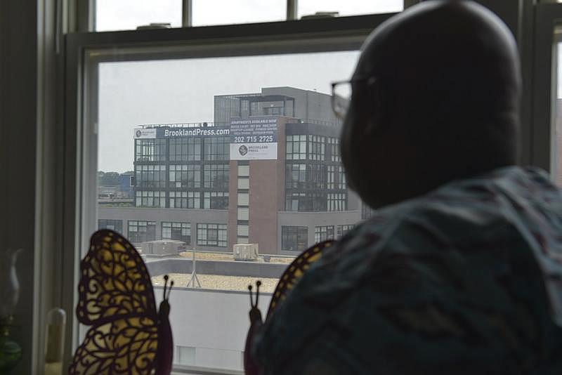 Donta Waters, the president of the tenants’ association, can see Brookland Press from his living room window. (Freddie Allen/AMG/NNPA) Donta Waters, the president of the tenants’ association, can see Brookland Press from his living room window. (Freddie Allen/AMG/NNPA)